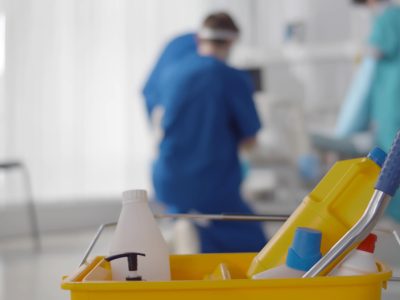 Focus,On,Bucket,With,Detergents,And,Nurse,Team,Cleaning,Ward